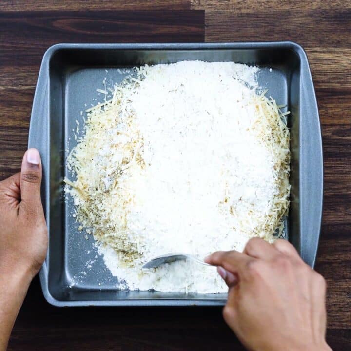 Mixing the flour, Parmesan cheese with seasonings.