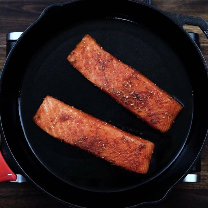 Seasoned Salmon in a cast iron.