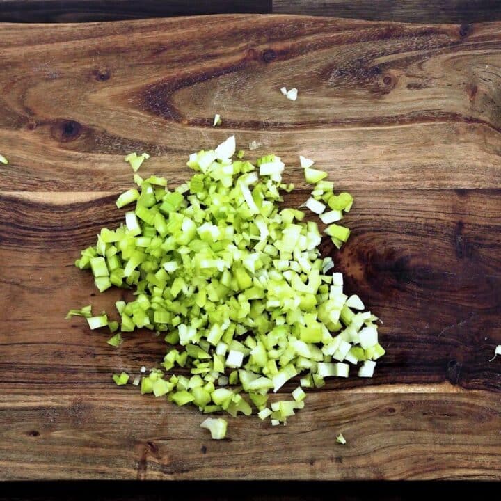 Diced celery on a cutting board.