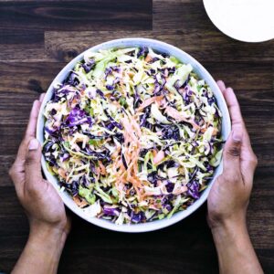 Serving the homemade coleslaw in a serving bowl.