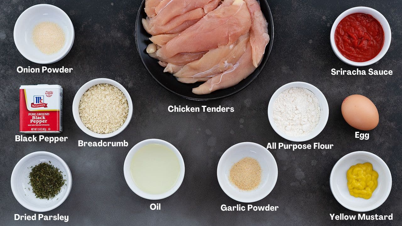 Fried Chicken Tenders recipe Ingredients arranged on a grey table.