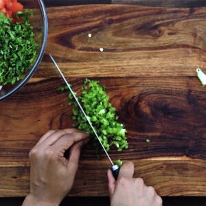 Dicing the Jalapeno peppers into small pieces.