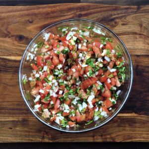 A bowl with Pico De Gallo.
