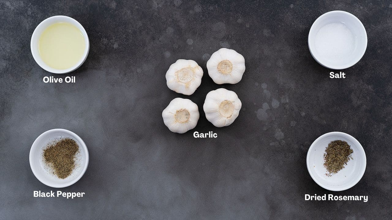 Roasted Garlic recipe Ingredients arranged on a grey table.