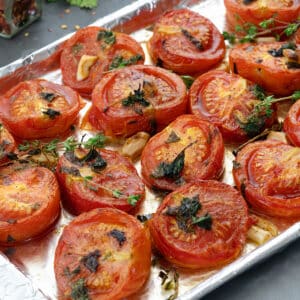 Close up of Oven Roasted Tomatoes in a baking tray.