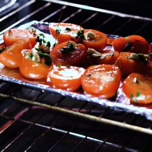 Tomatoes roasting inside the oven.