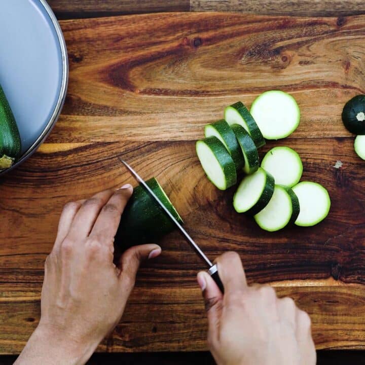Slicing the Zucchini using knife.