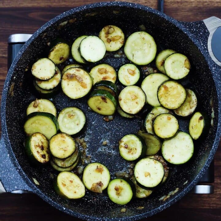 A pan with sauteed zucchini.