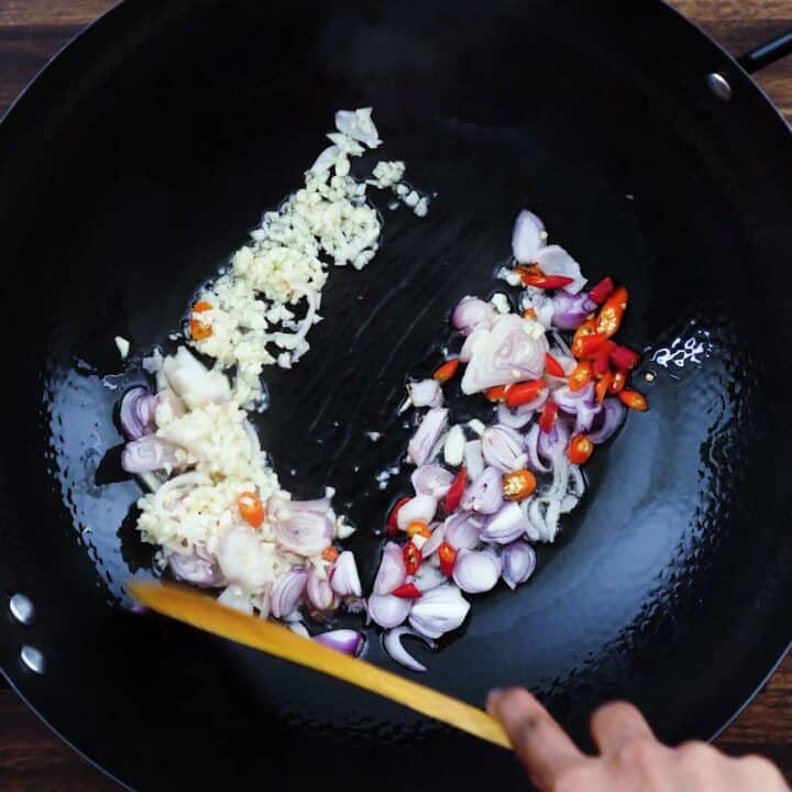 Sauteing the aromatics in high heat wok.
