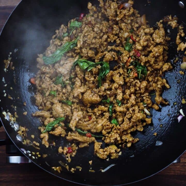 Thai Basil Chicken in a wok.