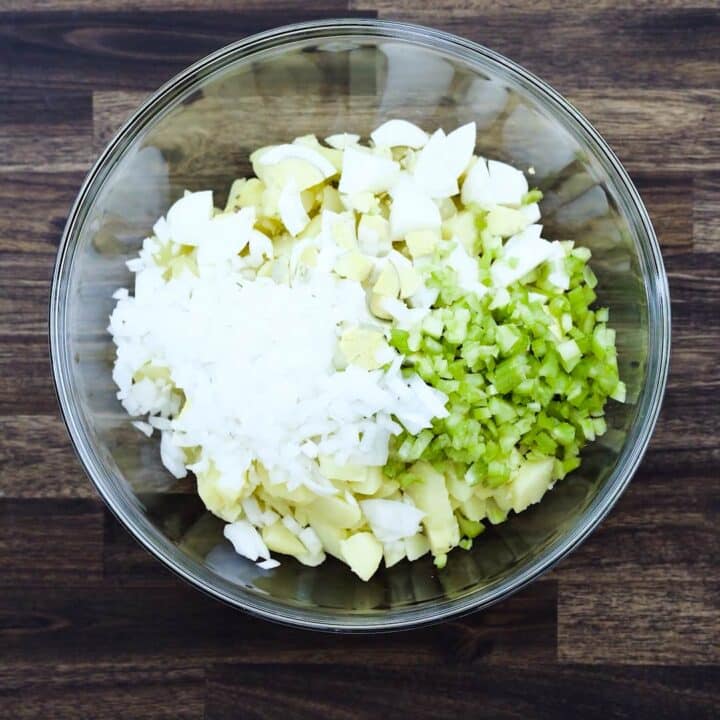 A bowl with potato salad mixture.