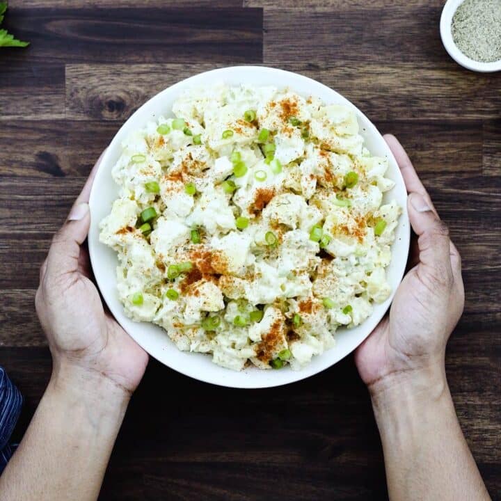 Serving Potato Salad in a white bowl.
