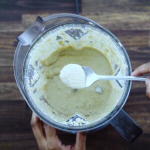 Showing the consistency of Tahini in a spoon.