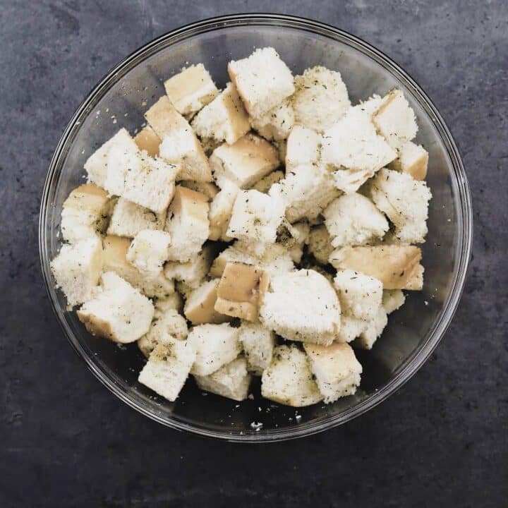 Seasoned bread cubes in a bowl.