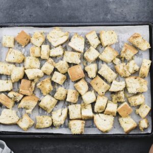 Perfectly baked croutons on a baking tray.