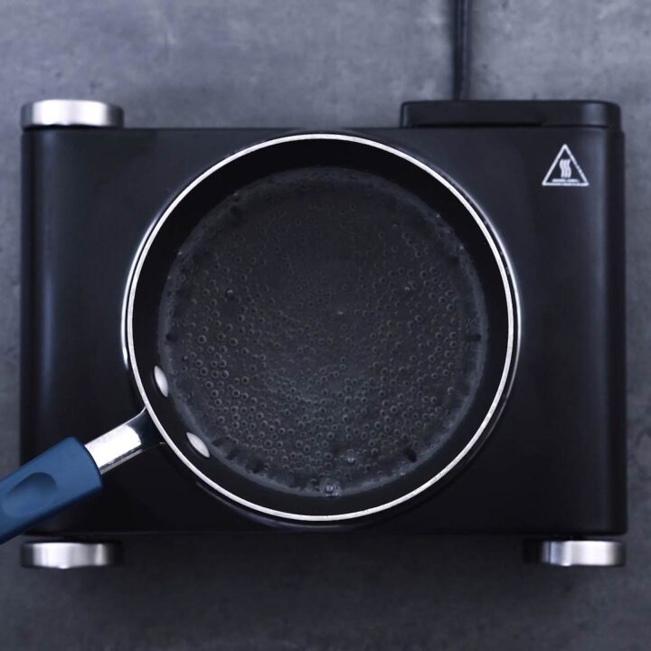 A saucepan with simmering water.