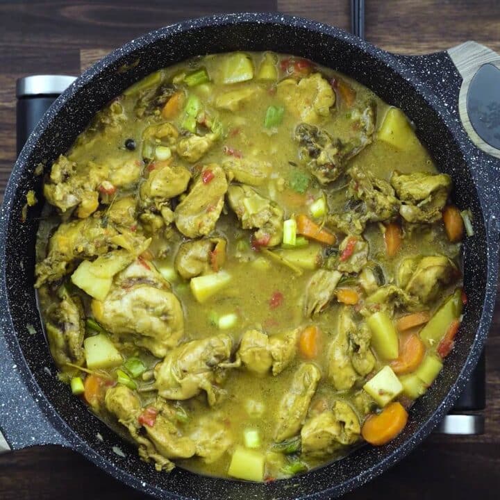 A pan with Jamaican Curry Chicken.