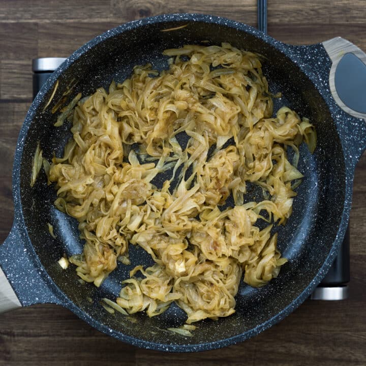 A pan with golden brown onions.