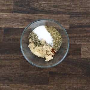A bowl with chicken seasoning ingredients.