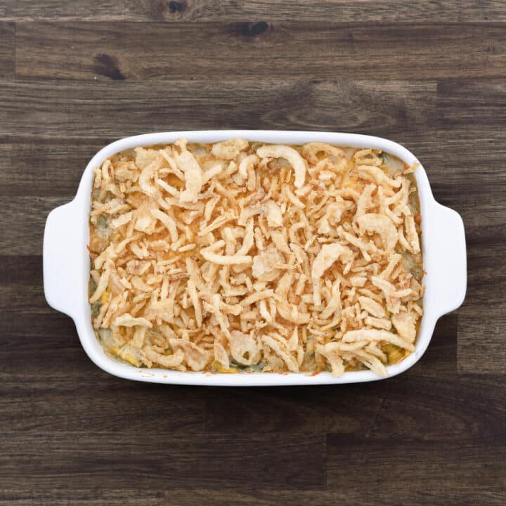 Baked Green Bean Casserole mixture topped with fried onions.