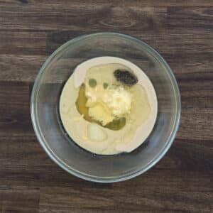 A bowl with Tahini dressing ingredients.
