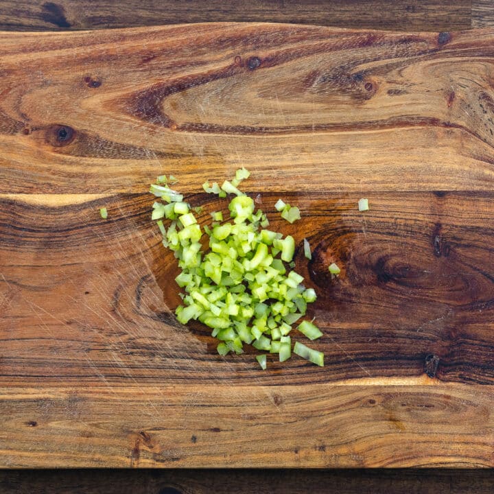Diced Celery on a cutting board.