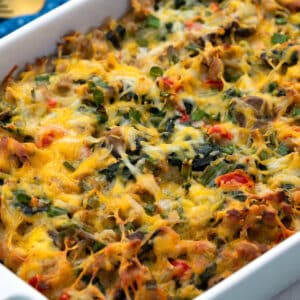 Homemade breakfast casserole in a white baking dish on a white table top.