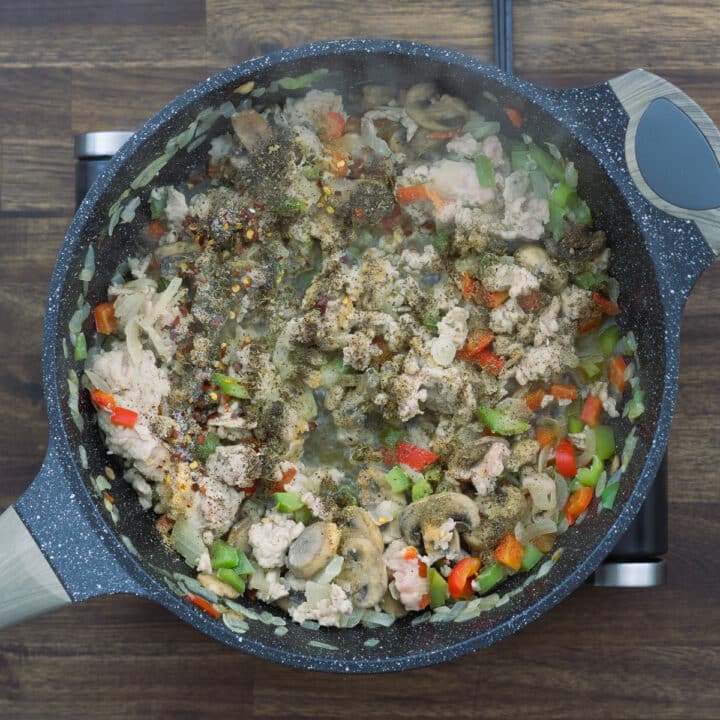 A pan with veggie meat mixture with seasonings.