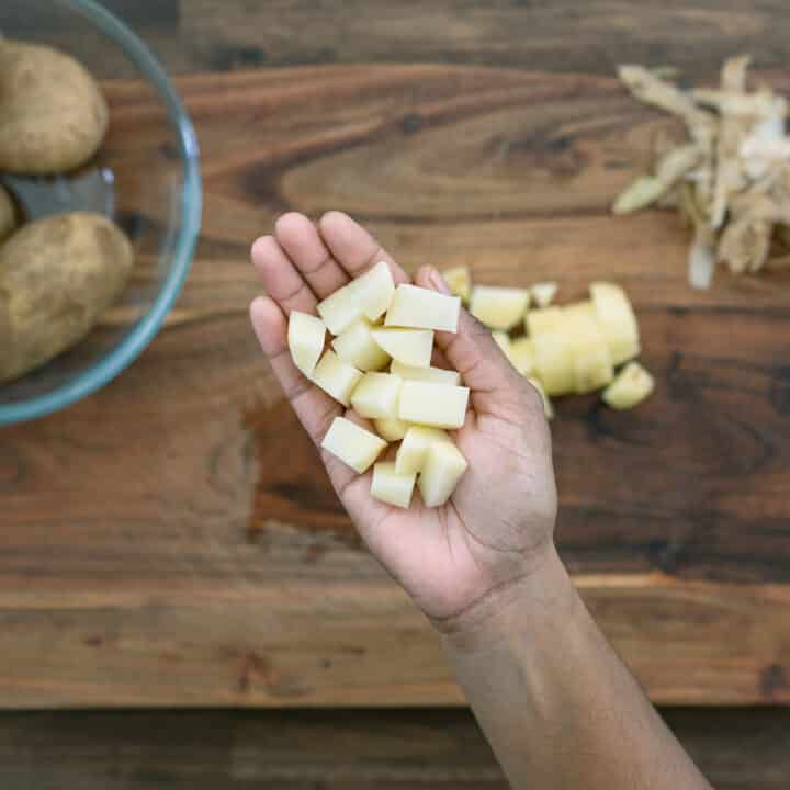 Showing peeled and diced potatoes.