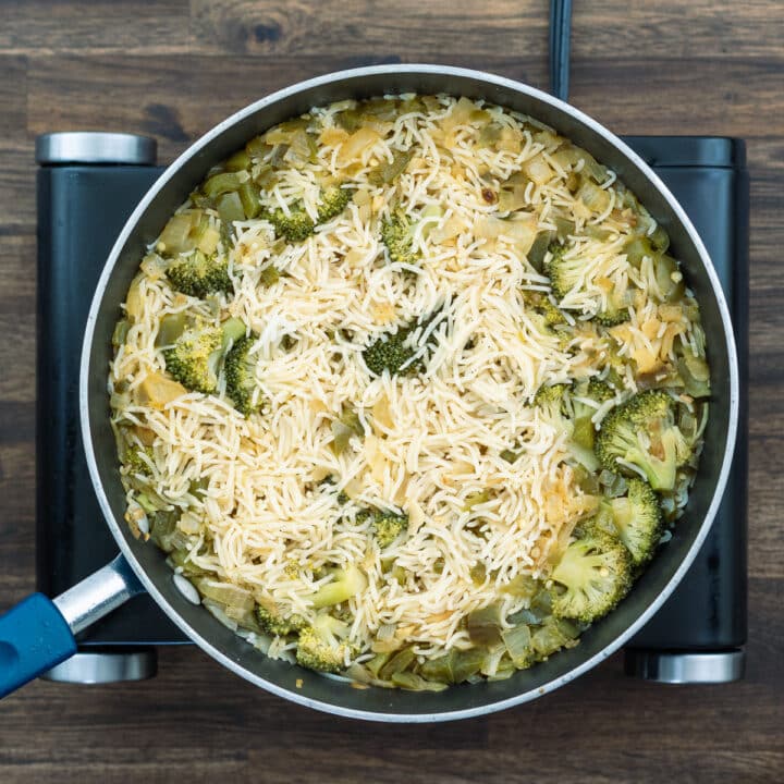 A pan with well cooked rice veggie mixture.