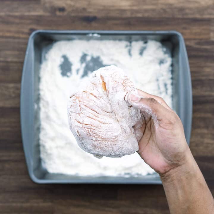 Showing flour coated chicken breast.