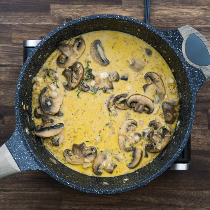 A pan with mushroom marsala sauce wine.