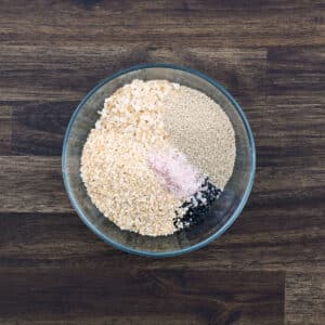 A bowl with everything Bagel Seasoning ingredients.
