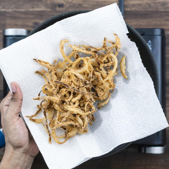 Crispy French Fried Onions on a paper towel.