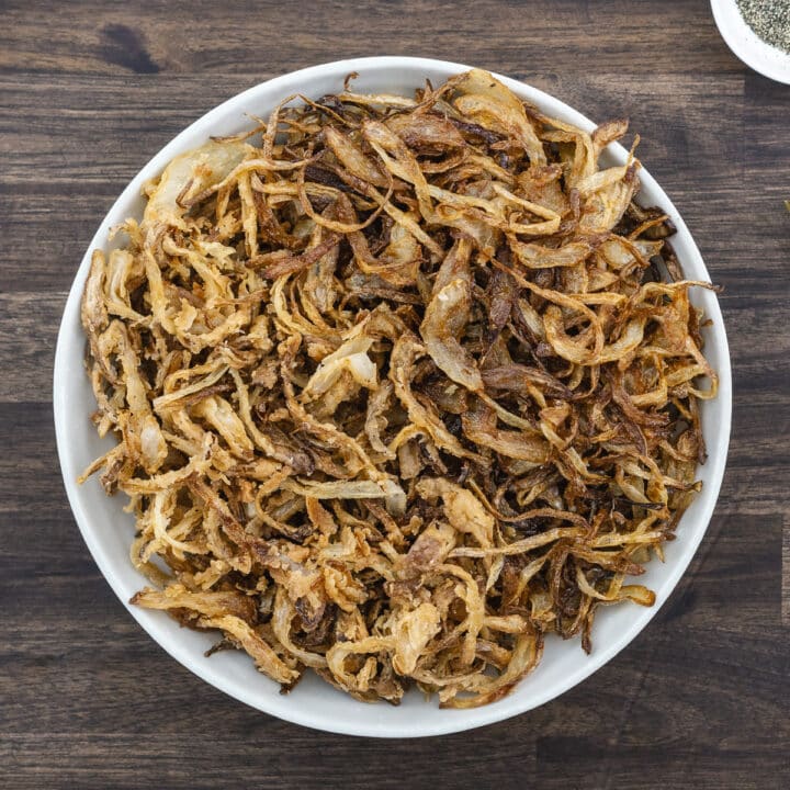 Classic and French Fried Onions in a serving white bowl.