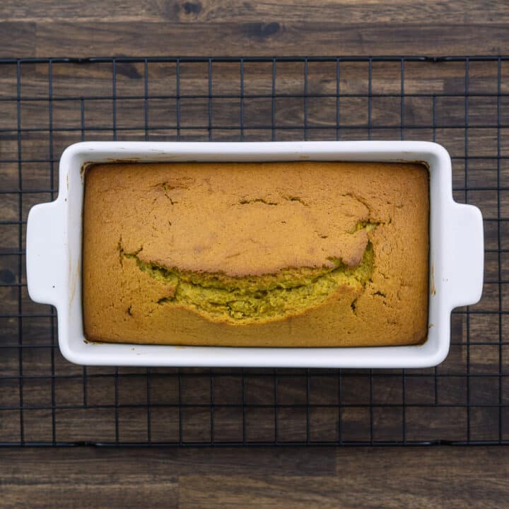 Pumpkin Bread in a loaf baking dish placed over a wire rack.