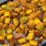 Roasted pumpkin in a baking tray.