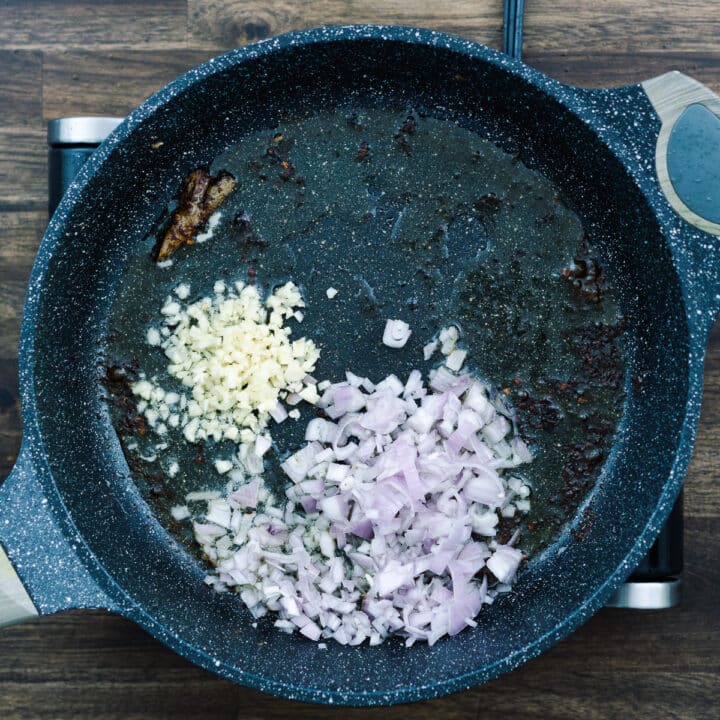 A pan with minced garlic and shallots.