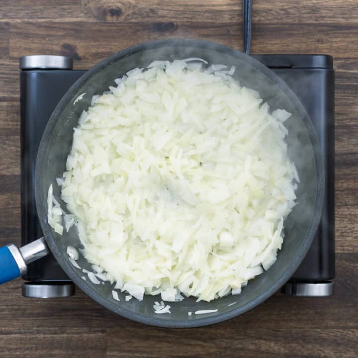 A pan with onions that turned soft.