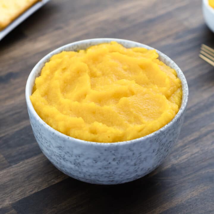 Pumpkin puree served in a white bowl.