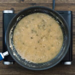 Pan with lemon butter sauce simmering.