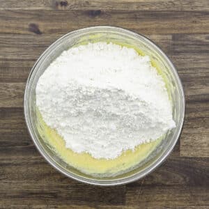A bowl with the flour mixture added to the egg-butter-sugar mixture.