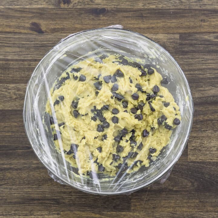 Chocolate chip cookie dough wrapped with plastic cling.