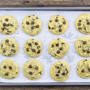 A baking tray with soft and chewy chocolate chip cookie dough.