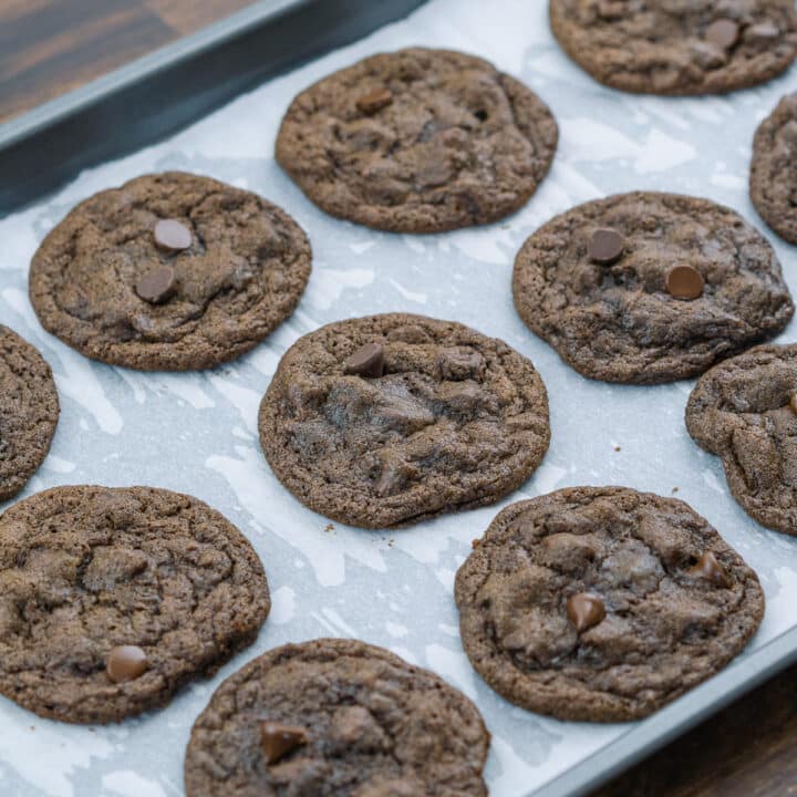 Double chocolate chip cookie dough served in a baking tray, ready to be enjoyed.