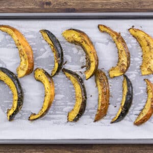 Roasted acorn squash elegantly served on a baking tray.