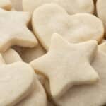 Assorted shortbread cookies in heart, star, and round shapes.