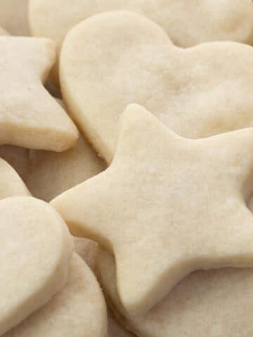 Assorted shortbread cookies in heart, star, and round shapes.