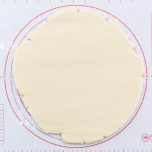 Rolled cookie dough on a rolling sheet.