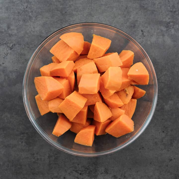 Bowl containing cooked sweet potatoes.